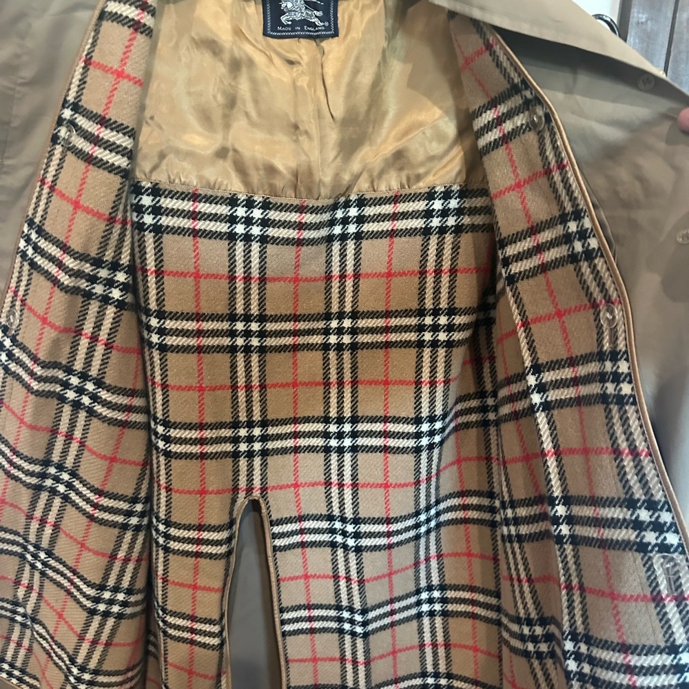 Authentic Burberrys’ trench coat (the original pre-1999 name of Burberry)